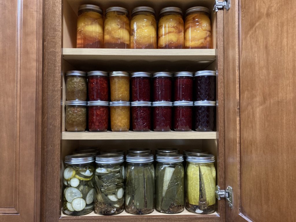 Shelves of canned goods I made in 2022.