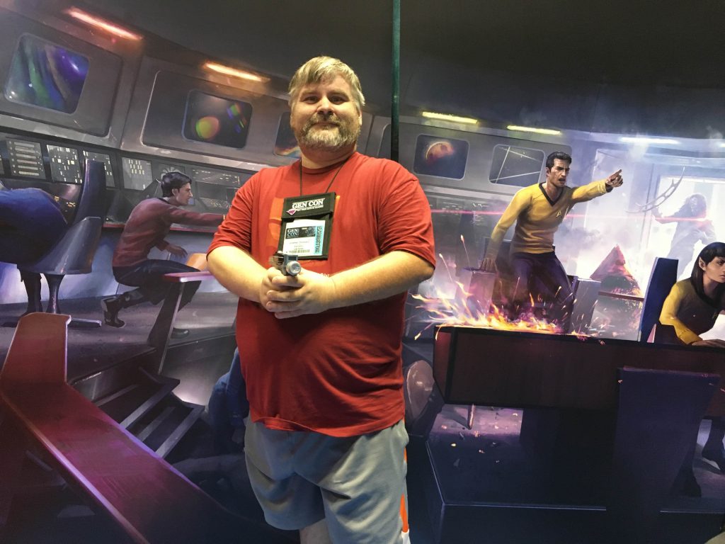 Jonathon Thompson at Gen Con 2016 acting like a Star Trek Red Shirt. 