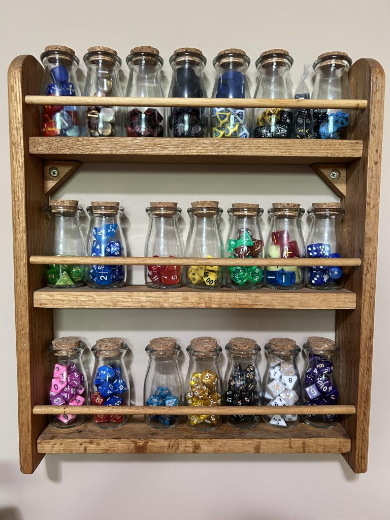 Space rack with dice in spice bottles.
